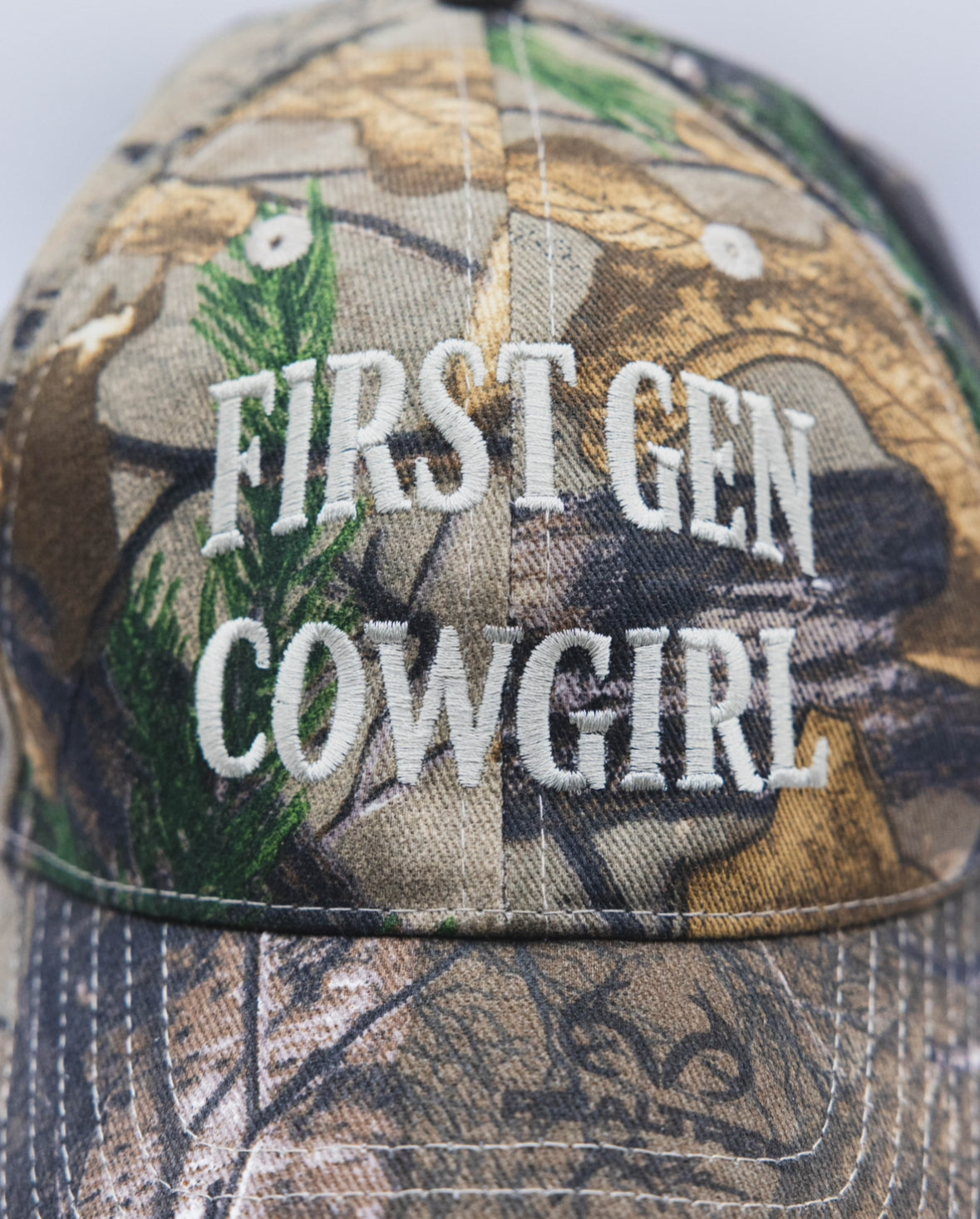 First Gen Cowgirl Camo Cap - Standard Logo in Ivory on Realtree